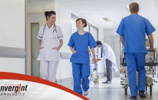Nurse and doctor walking with Convergint Logo
