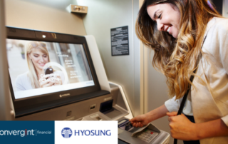 Women entering card into ITM bank machine